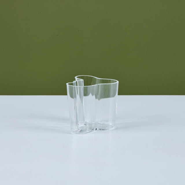A petite 'Savoy' vase from Alvar Aalto’s collection of blown glass vases for Iittala of Finland. This design has four...