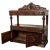 A fine antique Scottish Renaissance Revival carved oak server/ buffet, circa 1860. This sumptuously carved buffet with a...
