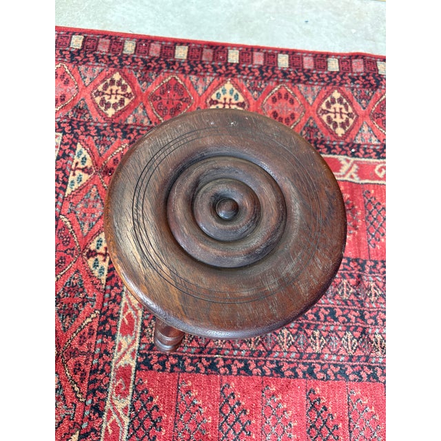 Charming antique Breton stool in solid wood, resting on three turned legs. This typical piece of French rural furniture is...