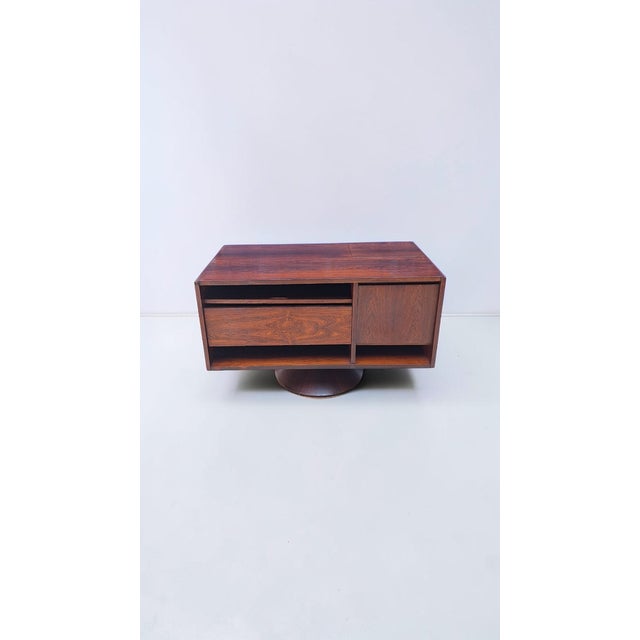 Revolving bar cabinet designed by Gianfranco Frattini for Bernini in the 1960s. The cabinet consists of a front section...