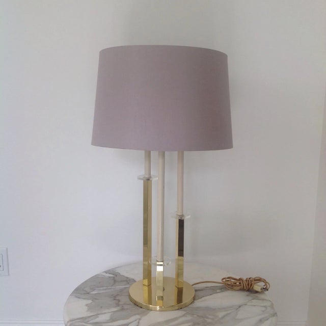 Hollywood regency style brass plated and lucite Table Lamp. Good working condition with original parts. Minor wear...