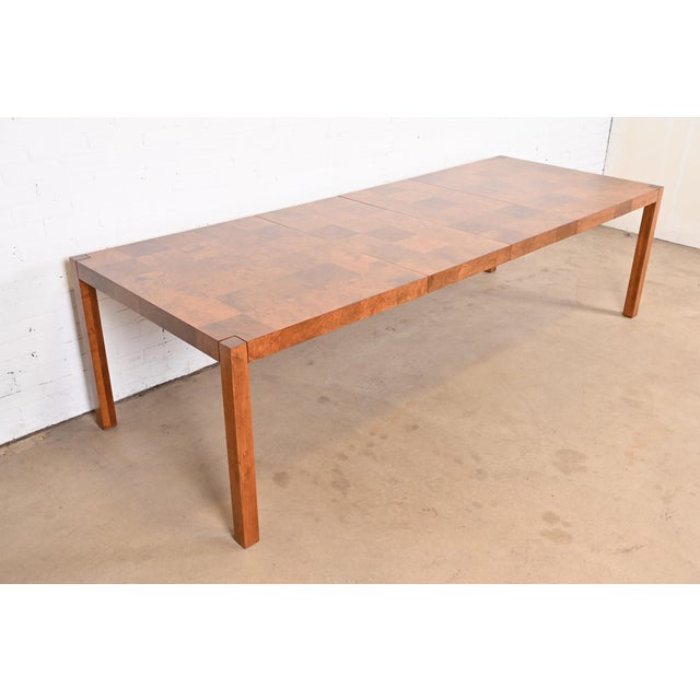 A gorgeous Mid-Century Modern patchwork burl wood Parsons extension dining table By Milo Baughman for Thayer Coggin USA,...