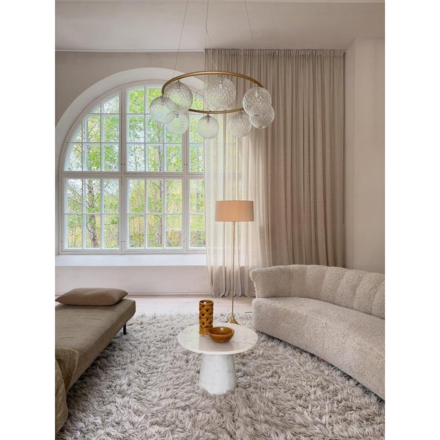 Wonderfully designed floor lamp from Bergboms Sweden. Made in brass and cast iron. Made in the 1960 and with a nice,...