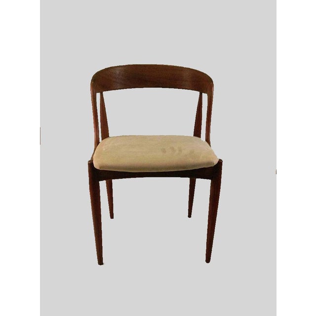 Set of eight fully restored organic shaped dining chairs in teak designed by the Danish designer Johannes Andersen for...