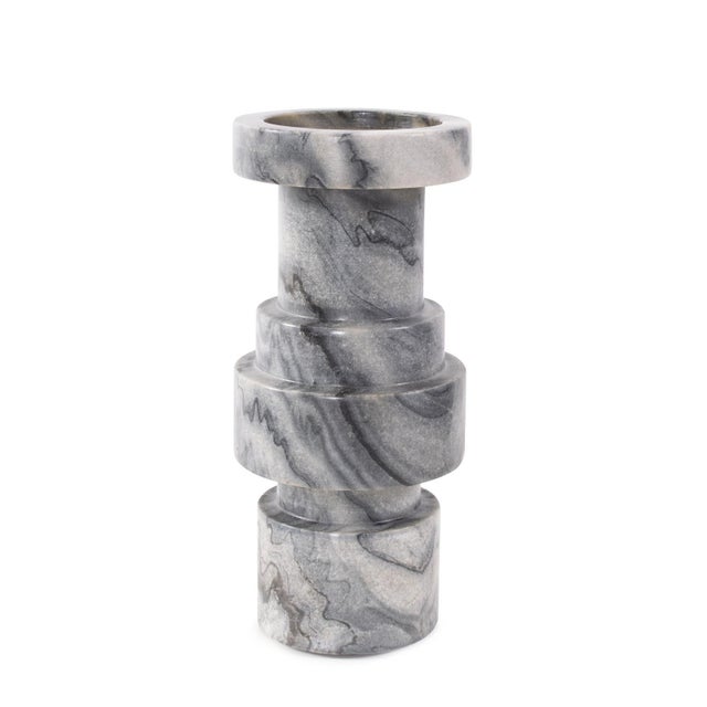 Whether used alone or paired together, this sturdy candle holder offers a captivating fusion of charcoal and various gray...