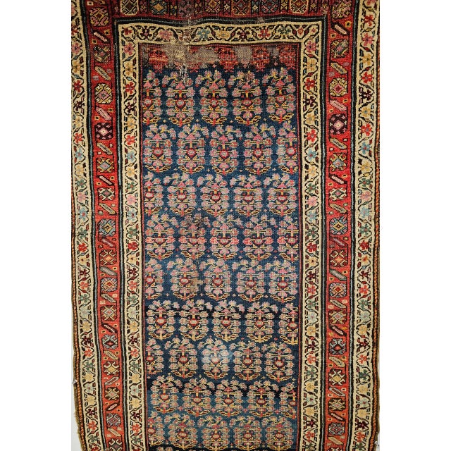 "A rare 19th century handwoven Persian Bidjar runner of exceptional beauty and historical significance, this piece carries...