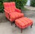 Antique carved wood bergère-style lounge chair with matching ottoman, featuring exceptionally vibrant plaid upholstery in...