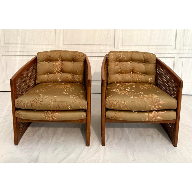 Here is a lovely pair of side chairs featuring solid wood frames with wonderful cane detailed sides. The chairs are...