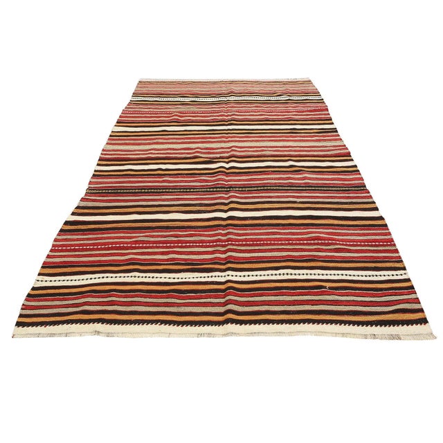 Handwoven vintage striped kilim rug from Denizli region of Turkey. Approximatelly 45-55 years old. In very good condition.