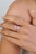 This elegant ring showcases a 1.94 carat natural oval pink sapphire, set in 18k white gold. The vibrant centre stone...