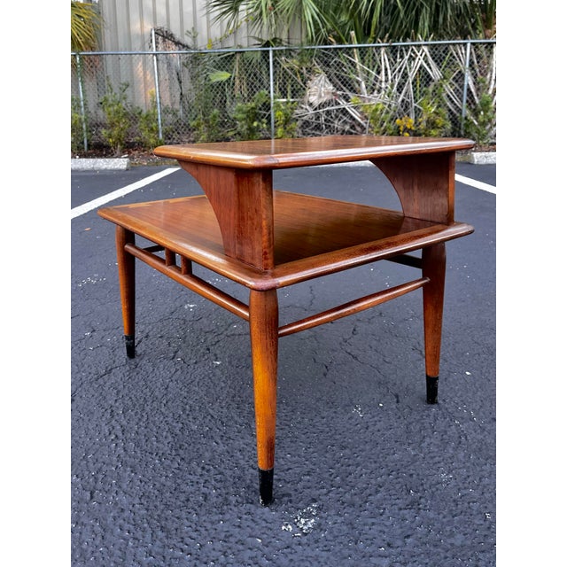 Mid-century modern two-tiered side table, Acclaim series by Lane Furniture. . Classic mid-century side table by Lane. With...