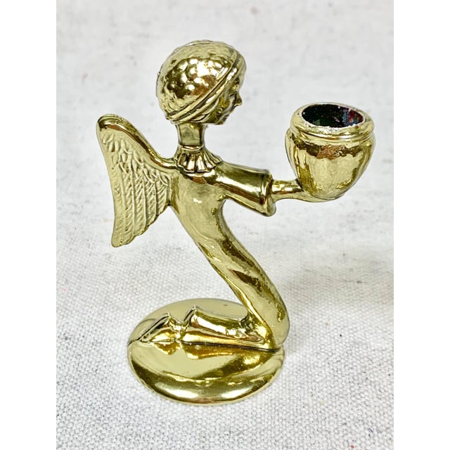 Lovely vintage set of metal candle holders. Each hold a mini taper candle. In the shape of a Christmas Angel. Set of 4....