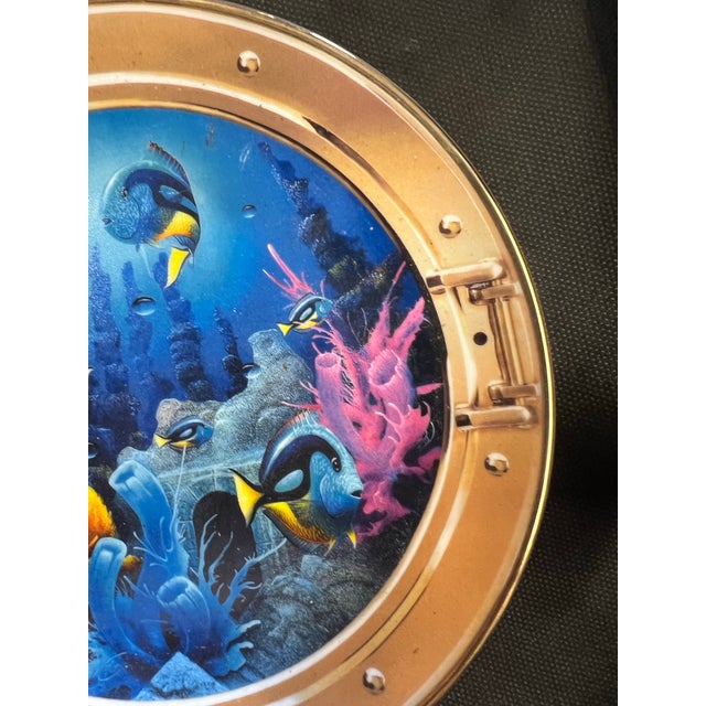 Vintage Decorative Plate featuring a vibrant underwater scene framed to look like a ship's porthole. This is a Royal...