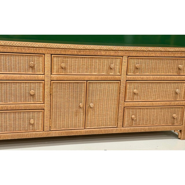 A classic Henry Link for Lexington Furniture woven rattan and wicker triple dresser, embodying the relaxed sophistication...