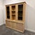 A stunning 1970s Italian rattan and bamboo display cabinet by Dal Vera, renowned for their refined craftsmanship and...