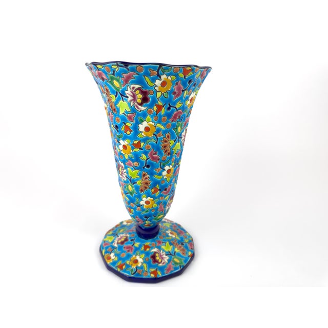 Vintage enamelled ceramic vase produced by the Longwy manufactory in France, featuring a vibrant floral pattern on a blue...