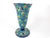 Vintage enamelled ceramic vase produced by the Longwy manufactory in France, featuring a vibrant floral pattern on a blue...