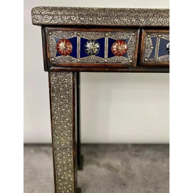 Behold the majestic allure of a handcrafted Hollywood Regency style console, intricately designed with a touch of Moorish...