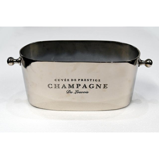 Stylish French silver plated champagne and wine cooler Classic oval form with polished finish Decorative ball handles to...