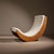A sculptural masterpiece of the 1970s, impressing with its ergonomic, curved silhouette. This rocking chair creates a...
