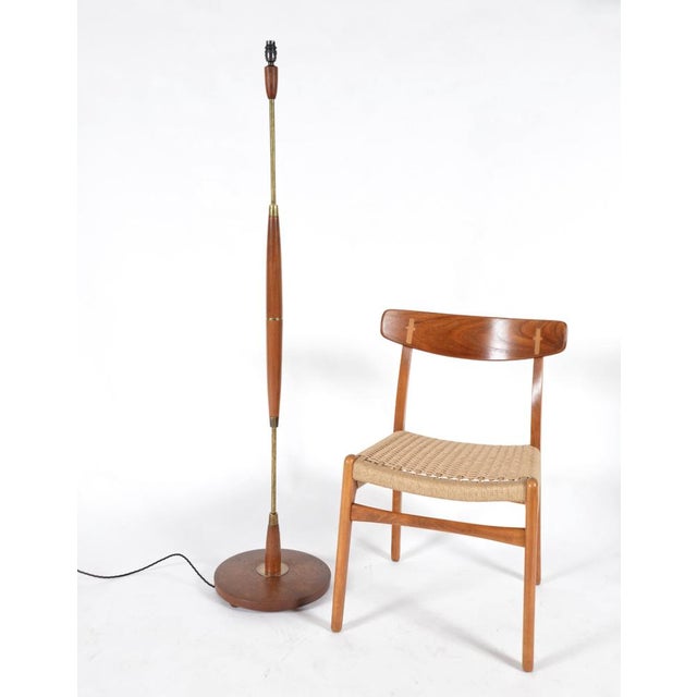 A very nice Midcentury Danish teak and brass tall standard lamp in good sturdy condition. The patination to the brass...
