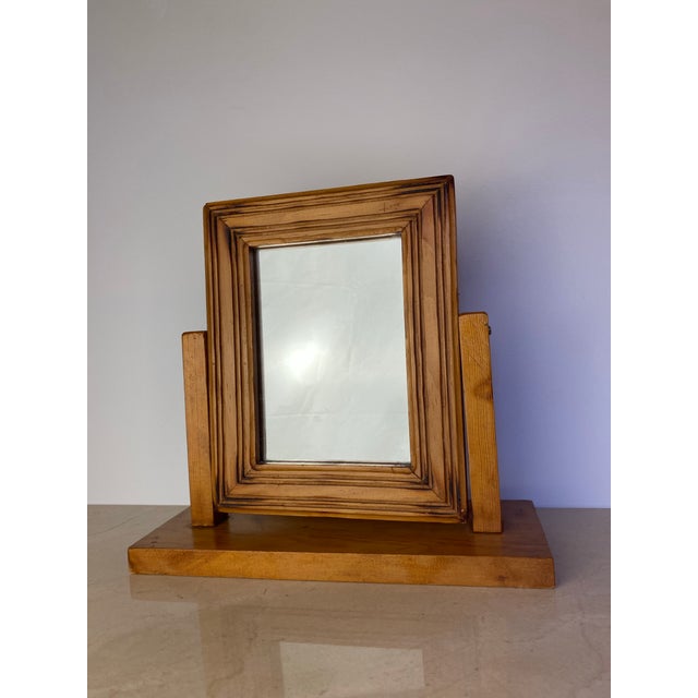 A handcrafted vintage tabletop picture frame showcasing the warmth and character of solid pine. The frame features deeply...