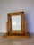 A handcrafted vintage tabletop picture frame showcasing the warmth and character of solid pine. The frame features deeply...