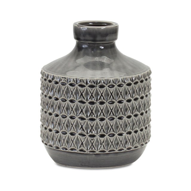 Bring contemporary charm to your home with this 9" Geometric Terra Cotta Vase in a striking black finish. Crafted from...