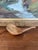 This 19th-century hand-carved wooden ladle is a striking example of early utilitarian craftsmanship, likely originating...