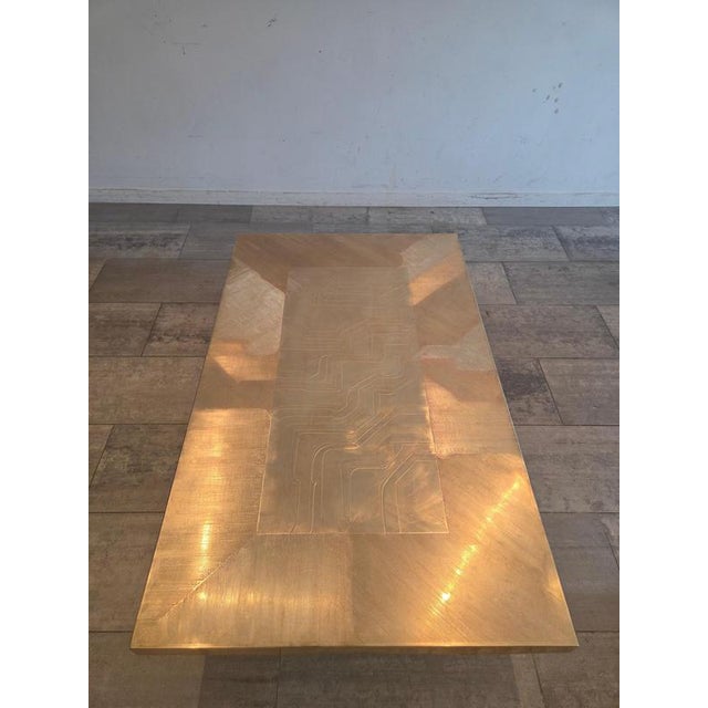 Elevate your interior with this exceptional brass etched table, a rare piece that embodies both artistry and refinement....