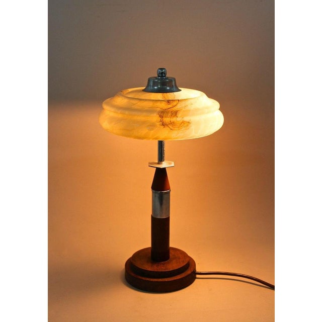 Unusual table lamp from the Art Deco period in Austria around 1930. An absolute extraordinary piece of lightning which...