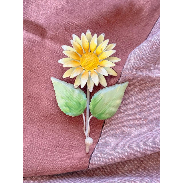 Charming vintage tole metal yellow daisy wall hook. A great addition to a powder bath to hold the hand towel, or use in...