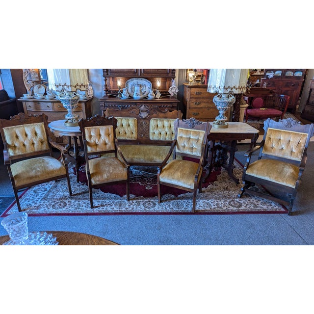 Victorian 5 pc parlour set, including settee, arm chair, platform rocker, two tea chairs. Walnut construction with...