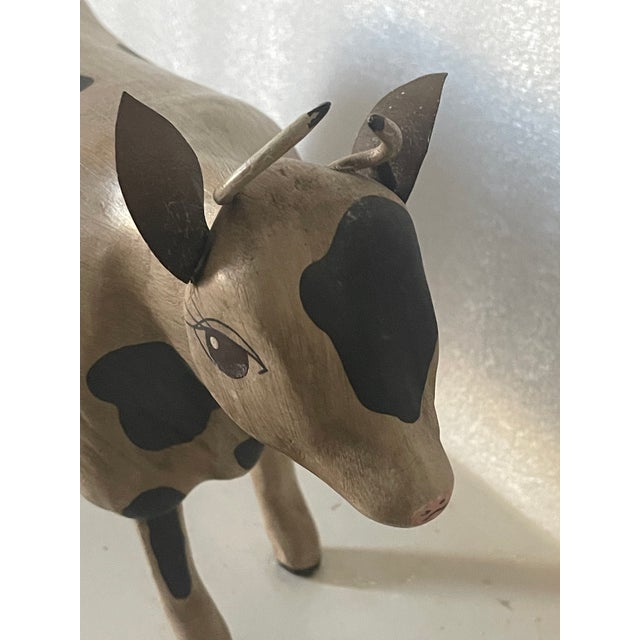 Cute folk art vintage cow figurine, handcarved wood painted and signed P.Campbell.