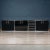 A superb four-piece sideboard consisting of three cabinets (one of which with dark smoked glass doors) and one bank of...