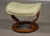 An Ekornes Stressless ottoman with off white beige cream leather and a teak base made for the reclining lounge chair....