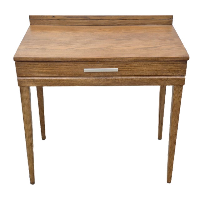 This is a very special solid oak writing desk that famed industrial designer Raymond Loewy designed for Mengel in the...