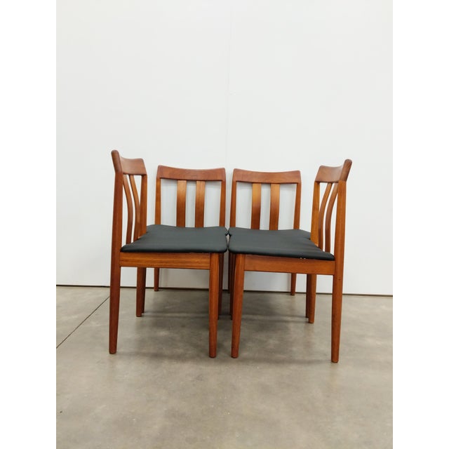 Set of 4 authentic vintage mid century Danish Modern solid teak wood dining chairs. By Vamdrup Stolefabrik. Maker's label...