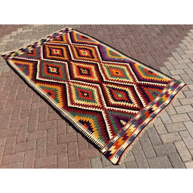 This beautiful, vintage, handwoven kilim is approximately 60 years old. It is handmade, of very fine quality hand spun...