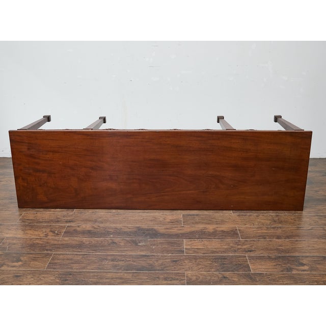 Crafted in the 19th century, this English Neoclassical style console table is built from rich, figured mahogany and stands...
