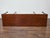 Crafted in the 19th century, this English Neoclassical style console table is built from rich, figured mahogany and stands...