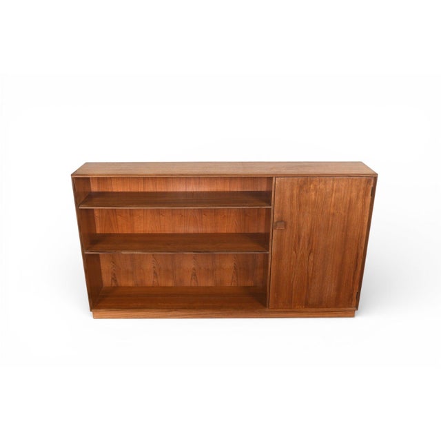 Origin: England Designer: Ib Kofod Larsen Manufacturer: G Plan Era: 1961 Materials: Teak, Rosewood Measurements: 60" wide...