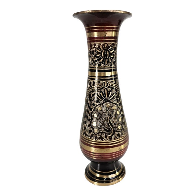 This hand-engraved brass vase presents the intricate surface language associated with Nakkashi workshop craftsmanship. A...