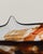 Large oval mouth with pointed ends and a narrowed circular base. Decorated with different colors creating watery shapes...