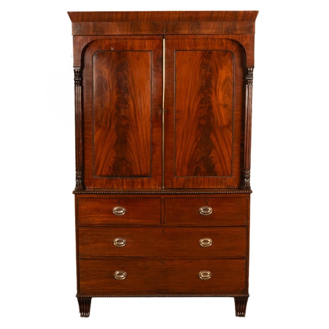 A fine antique early 19th Century Georgian Regency period flame mahogany linen press, chest, English, circa 1800. This...