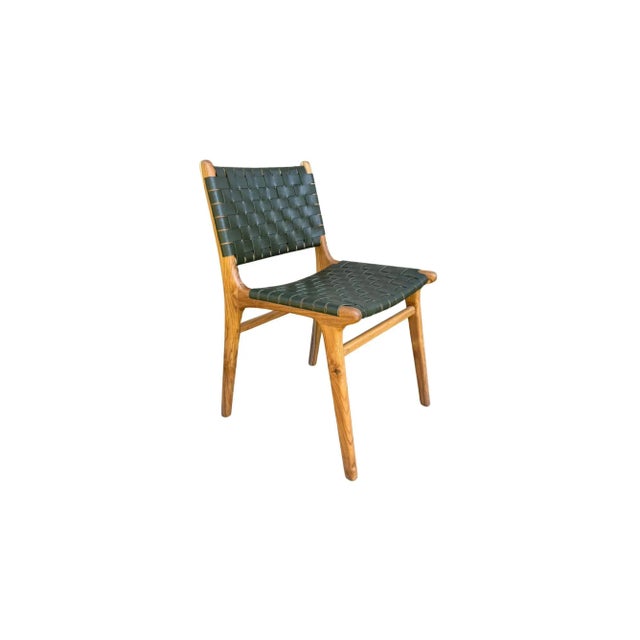 A pair of hand-crafted teak framed & woven leather strap chair. These chairs are crafted by local artisans using a wood...