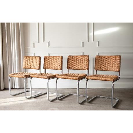 Vintage 1970s Cesca-style chairs featuring a chrome cantilever frame and hand woven cane seat and back. Their light, airy...