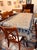 This densely embroidered tablecloth was never used. It has been stored carefully wrapped to keep any dust from entering...