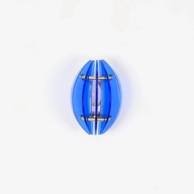 7 wonderful mid-century wall sconce in a vibrant blue murano glass and solid brass. This gorgeous piece was designed by...