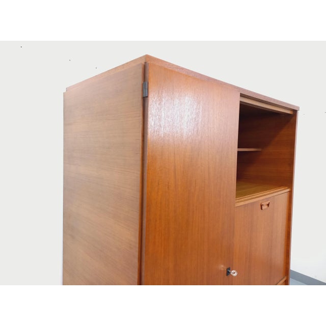 Vintage Scandinavian-style teak writing desk / storage unit from the 1960s, with beautiful original compass legs. This...